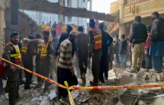 Death toll from attack at police HQ in Pakistan rises to 31
