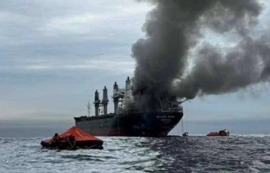 Commercial vessel struck in Strait of Hormuz, catches fire